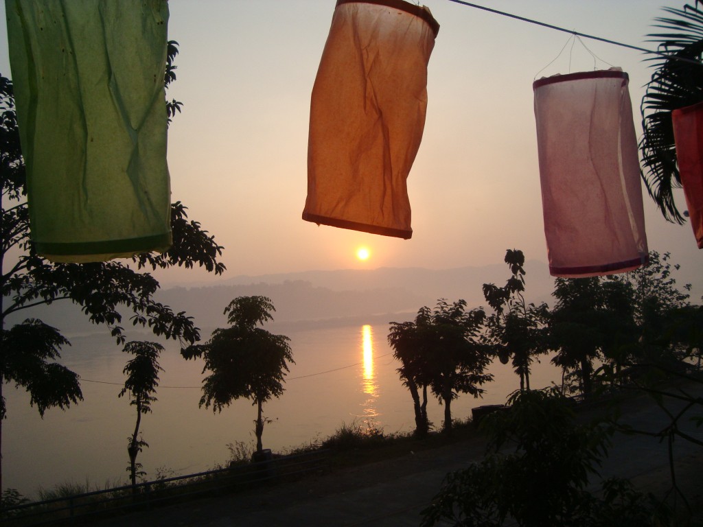 Sunrise on the Mekong River (from Thailand). Also our first glimpse of Laos across the river.