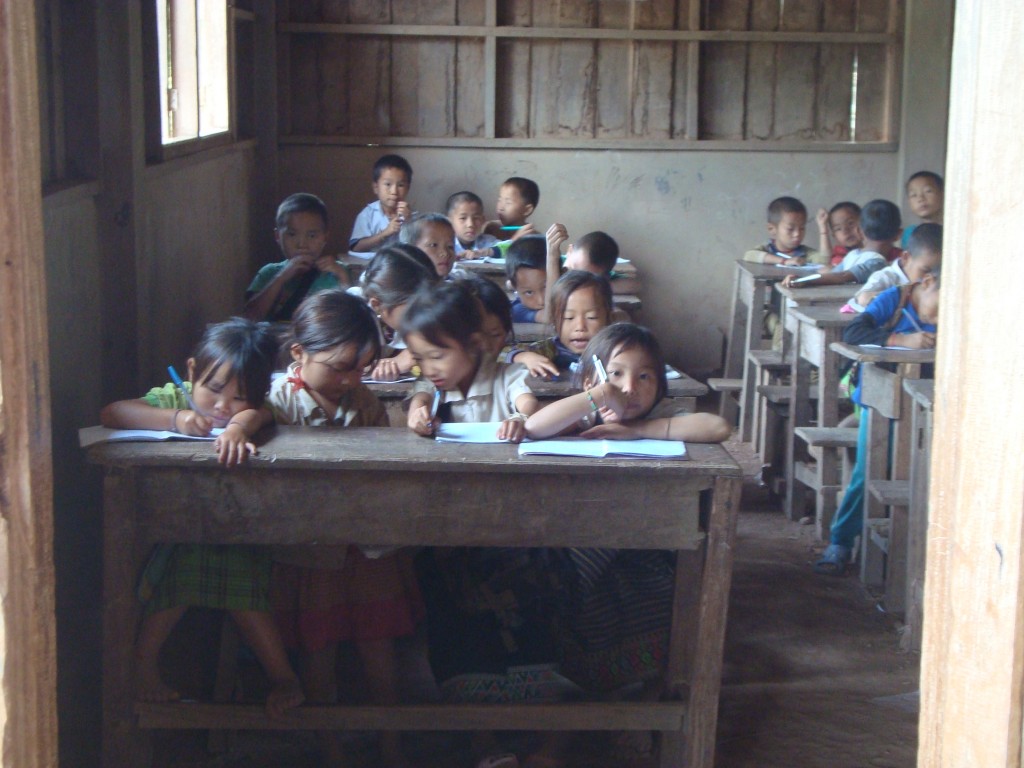 Peeking in on a school in one of the hill tribe villages in rural Laos (which is where much of the population lives).
